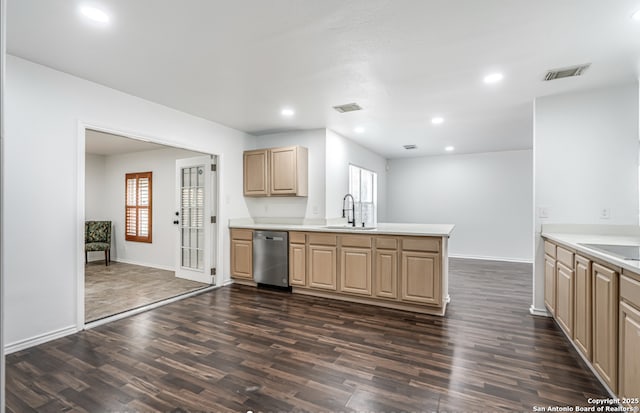 kitchen with stainless steel dishwasher, dark wood-type flooring, a sink, and visible vents