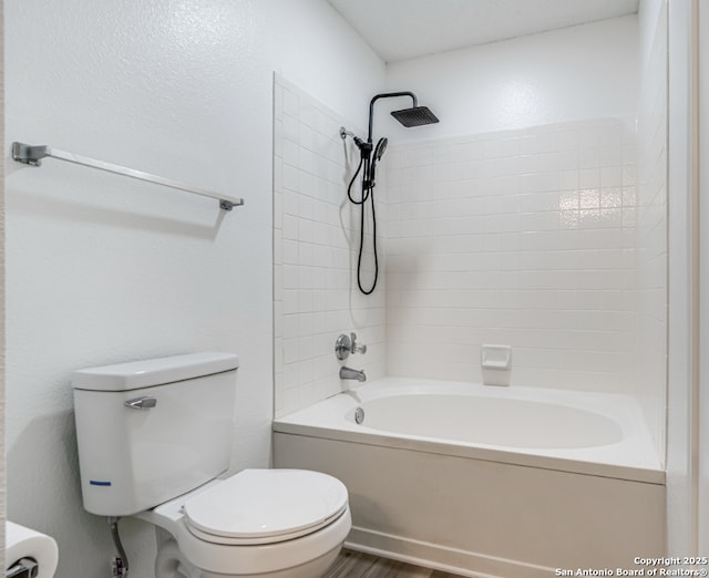 full bathroom with shower / bath combination, wood finished floors, and toilet