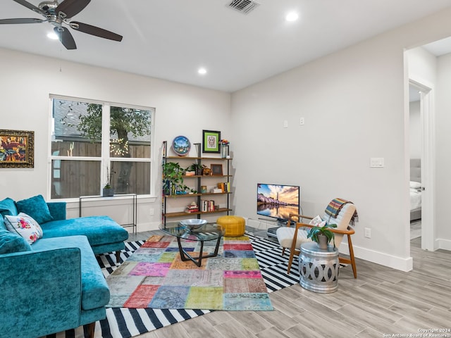 sitting room with baseboards, visible vents, a ceiling fan, wood finished floors, and recessed lighting