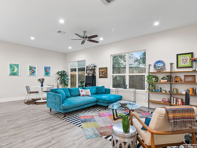 living area featuring baseboards, visible vents, a ceiling fan, wood finished floors, and recessed lighting