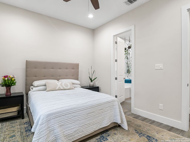 bedroom featuring recessed lighting, visible vents, connected bathroom, wood finished floors, and baseboards