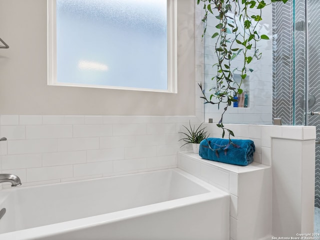 bathroom featuring a garden tub