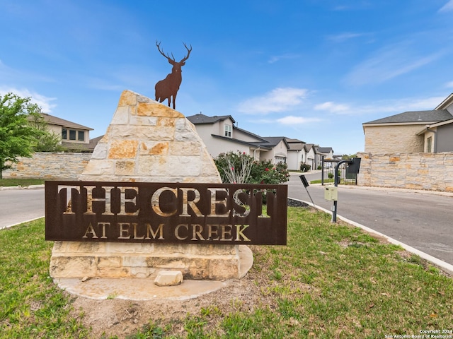 community / neighborhood sign featuring a residential view