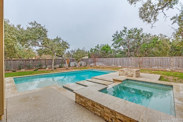 view of pool featuring a patio and a fenced backyard