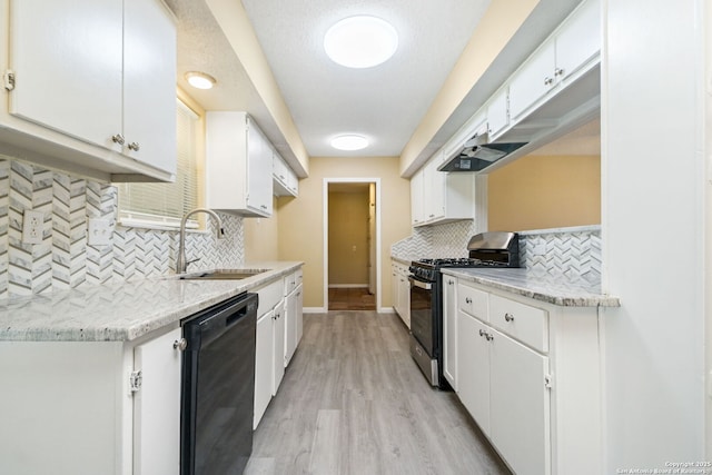 kitchen with stainless steel gas stove, light wood finished floors, black dishwasher, white cabinetry, and a sink