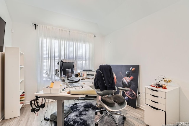 office area featuring light wood-type flooring and baseboards