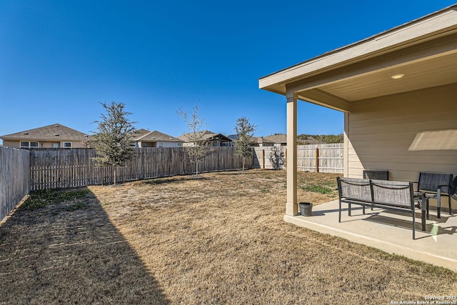 view of yard with a fenced backyard and a patio