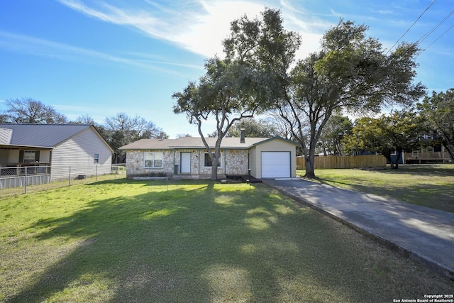 view of front facade with a garage, driveway, a front yard, and fence