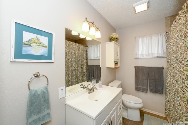 full bath featuring toilet, a textured ceiling, and vanity