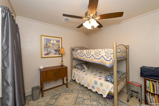 bedroom with ceiling fan, visible vents, and ornamental molding