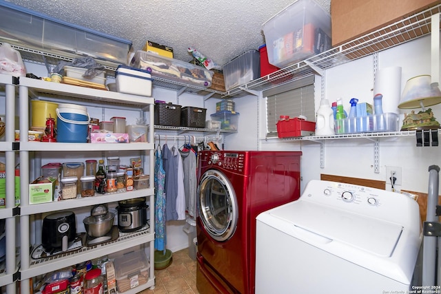 laundry room featuring laundry area, a textured ceiling, and independent washer and dryer