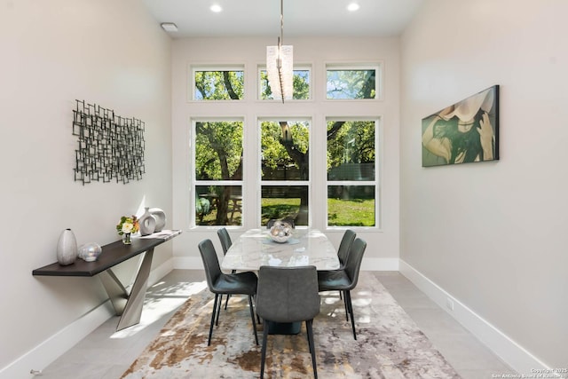 dining space featuring recessed lighting and baseboards