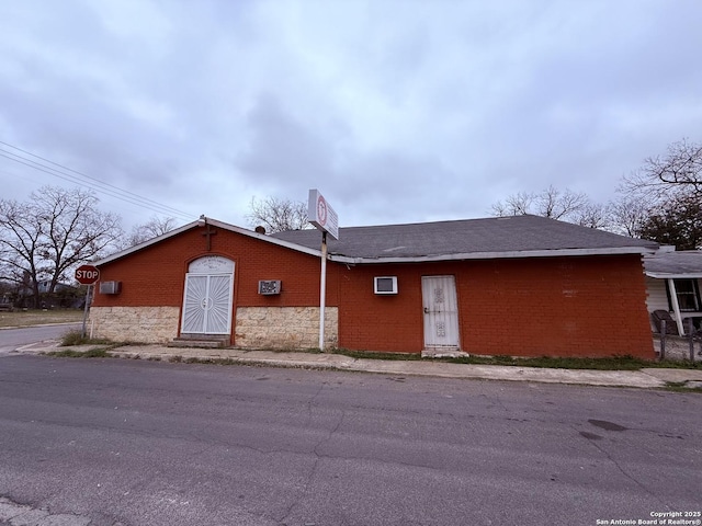 exterior space with brick siding