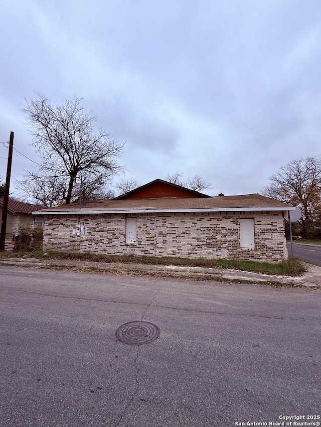 view of home's exterior featuring brick siding