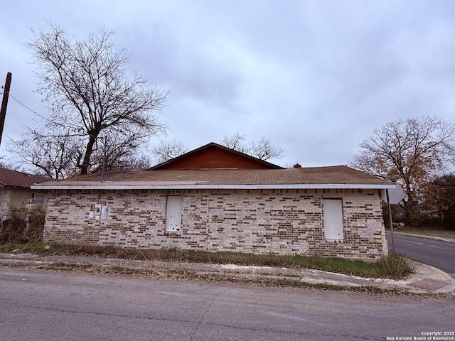 view of home's exterior featuring brick siding