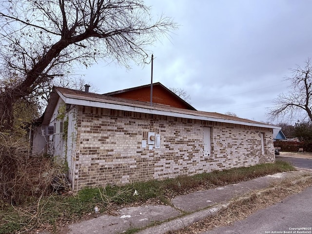 view of home's exterior featuring brick siding