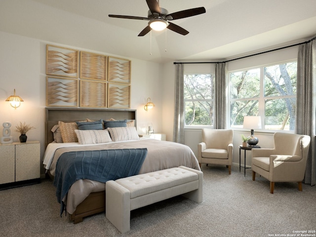 bedroom with vaulted ceiling, carpet, and a ceiling fan