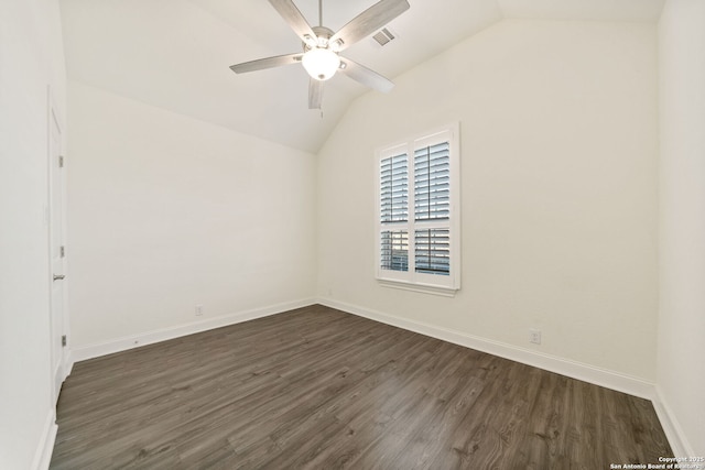 unfurnished room with dark wood finished floors, visible vents, vaulted ceiling, ceiling fan, and baseboards