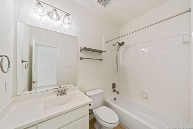 bathroom with toilet, shower / bath combination, vanity, and visible vents