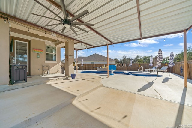 view of patio featuring a fenced in pool, a fenced backyard, and ceiling fan