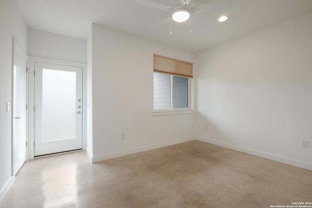 unfurnished room featuring ceiling fan, finished concrete floors, baseboards, and recessed lighting