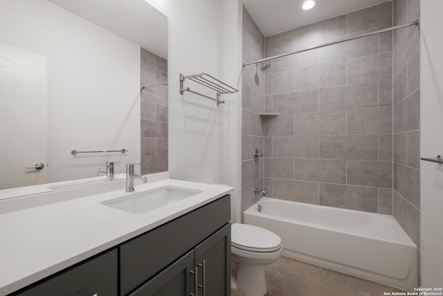 bathroom featuring toilet, bathtub / shower combination, and vanity