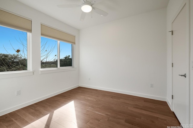 unfurnished bedroom with wood finished floors, a ceiling fan, and baseboards