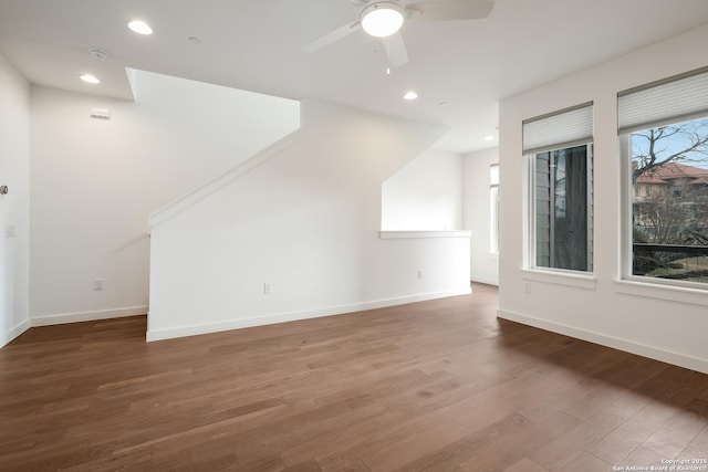 unfurnished living room featuring a ceiling fan, baseboards, wood finished floors, and recessed lighting