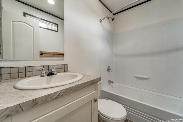 bathroom featuring shower / washtub combination, vanity, and toilet