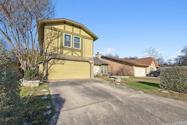 view of front of house with driveway, an attached garage, and stucco siding