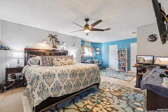 bedroom with visible vents, ceiling fan, a textured ceiling, and light tile patterned flooring