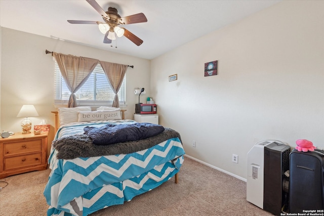 bedroom featuring carpet floors, baseboards, and a ceiling fan