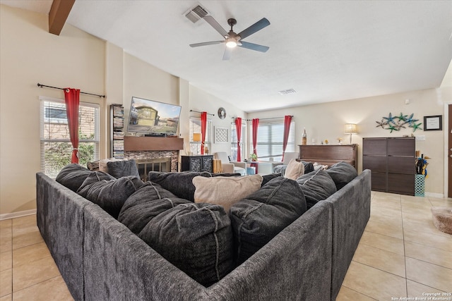 living area featuring visible vents, a fireplace, lofted ceiling with beams, and light tile patterned floors