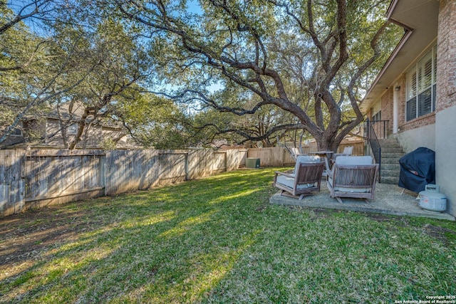 view of yard with stairway and a fenced backyard