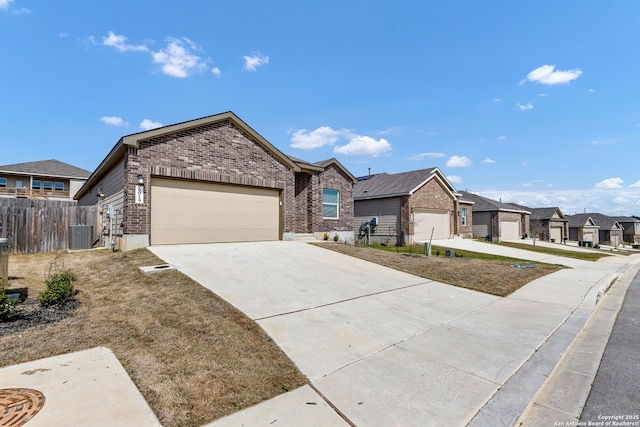 ranch-style home featuring a garage, driveway, a residential view, fence, and brick siding