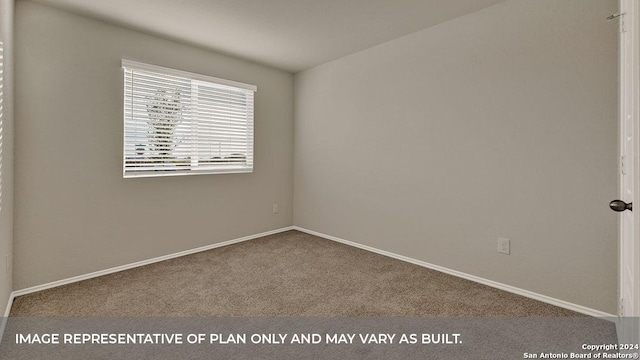 spare room with carpet floors and baseboards