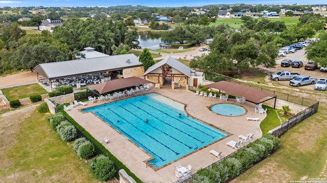 pool featuring fence, a gazebo, and a patio