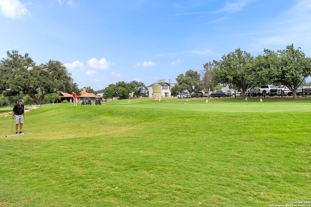 surrounding community featuring a lawn