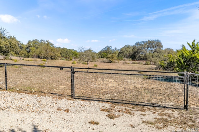 exterior space with a rural view and fence