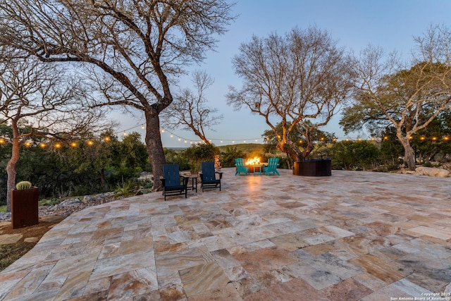 view of patio / terrace featuring an outdoor fire pit