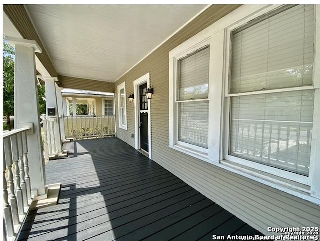 wooden terrace with covered porch