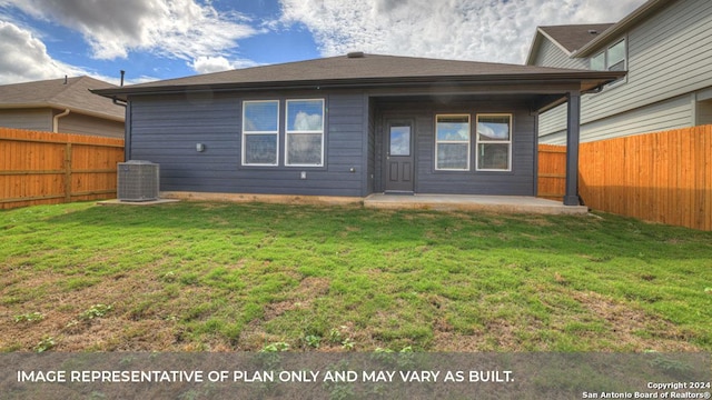 rear view of house with a lawn, a fenced backyard, and central air condition unit