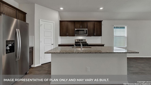 kitchen with stainless steel appliances, stone counters, a sink, and dark brown cabinetry