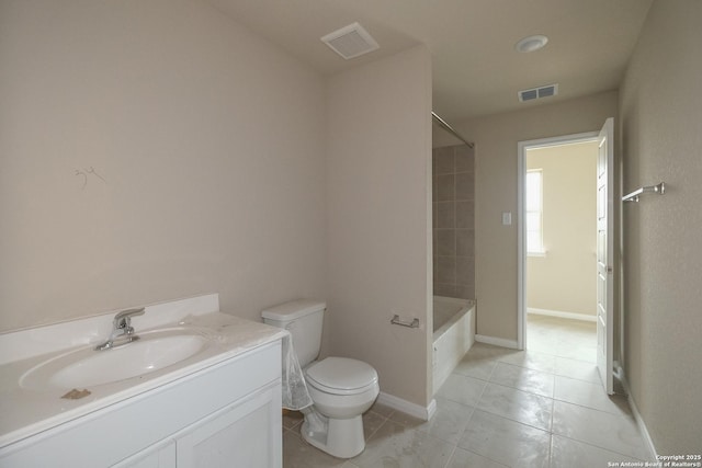 bathroom featuring toilet, tile patterned floors, vanity, washtub / shower combination, and baseboards