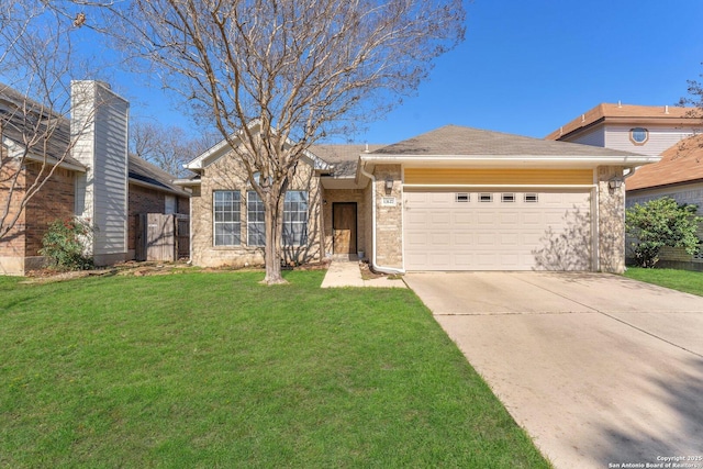 ranch-style house featuring an attached garage, brick siding, driveway, and a front yard