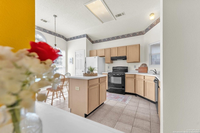 kitchen featuring under cabinet range hood, visible vents, freestanding refrigerator, black electric range oven, and light brown cabinetry