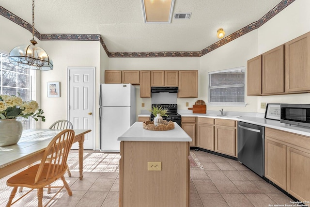 kitchen featuring a kitchen island, a sink, visible vents, appliances with stainless steel finishes, and ventilation hood