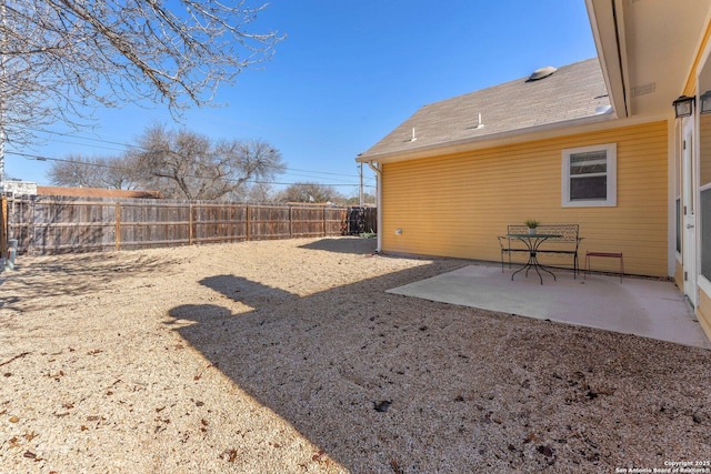 view of yard with a patio and a fenced backyard