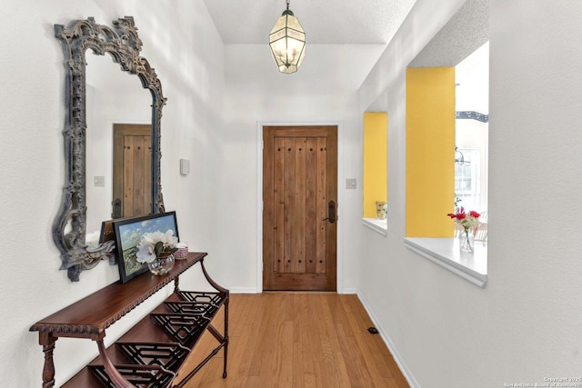 interior space with light wood-style flooring and baseboards