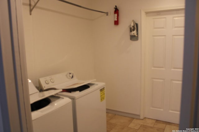 laundry room featuring laundry area and washing machine and clothes dryer